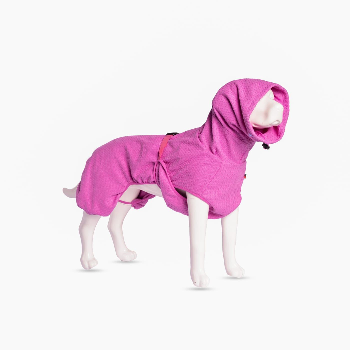 Pink dog drying robe with hood and adjustable belly strap on a dog mannequin